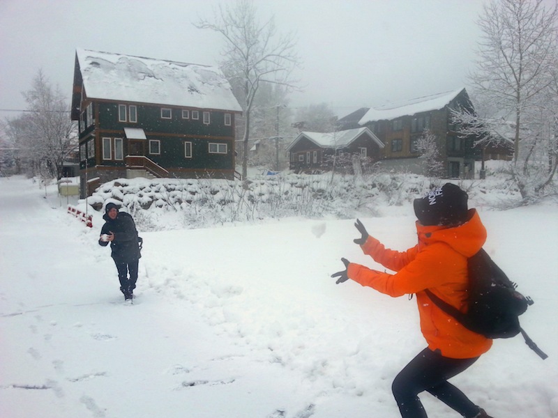 Ben and Mika having a snowball fight in the fresh pow pow