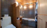 Shin Shin Bathroom with Bathtub and Lamps | Lower Hirafu