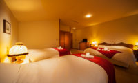 Marillen Hotel Bedroom with Triple Beds and Carpet | Happo Village