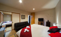 Luna Hotel Bedroom with Sofa and TV | Upper Wadano