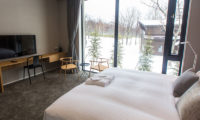 The Kamui Niseko Bedroom with TV and Outdoor View | Annupuri