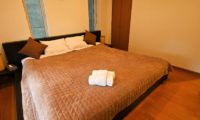 Hurry Slowly Condominiums Bedroom with Wooden Floor | Lower Hirafu
