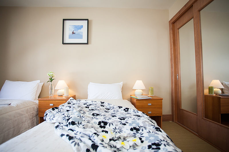 Niseko Alpine Apartments Twin Bedroom with Table Lamps | Upper Hirafu Village