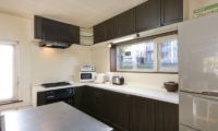 Powderhound Lodge Kitchen Area with Wooden Floor | Upper Hirafu