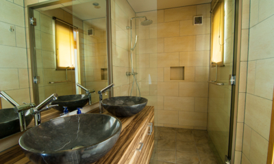 Creekside His and Hers Bathroom with Shower | Annupuri