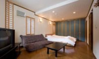 Slowlife Niseko Bedroom with Sofa | East Hirafu