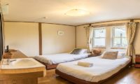Jam Lodge Niseko Twin Bedroom with Wooden Floor | West Hirafu