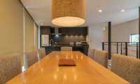 Kawasemi Residence Kitchen and Dining Area with Hanging Light | Lower Hirafu