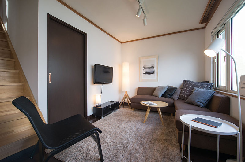 Kuma Cabin Lounge Area with TV | Lower Hirafu