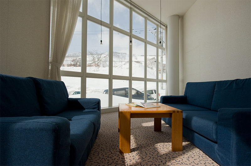 Owashi Lodge Lounge Area with Mountain View | Upper Hirafu