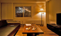 J-Sekka Suites Lounge Area with Night View | Middle Hirafu