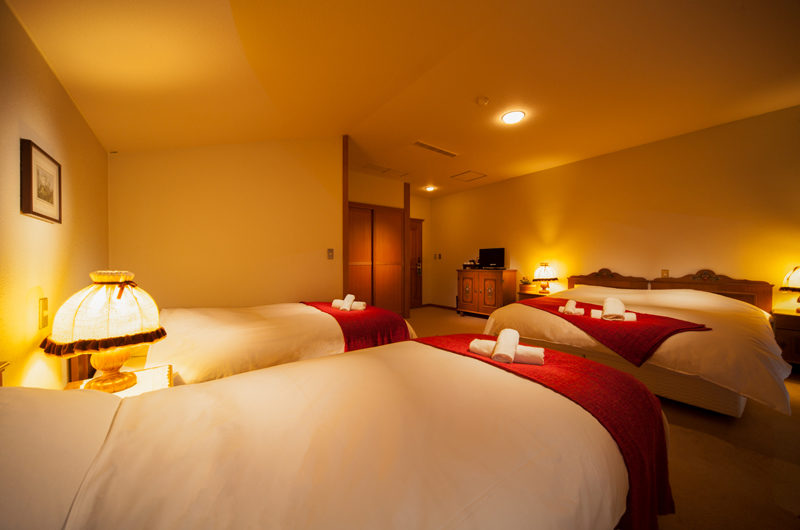 Marillen Hotel Bedroom with Triple Beds and Carpet | Happo Village