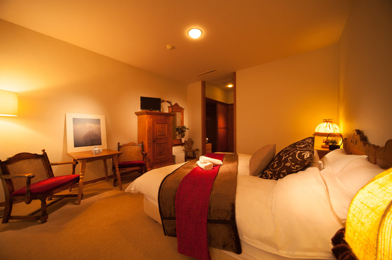 Marillen Hotel Bedroom with Seating Area | Happo Village