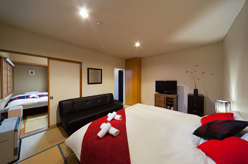 Luna Hotel Bedroom with Sofa and TV | Upper Wadano