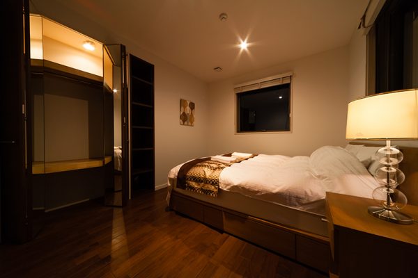 Phoenix Chalets Bedroom at Night with Lamp | Lower Wadano