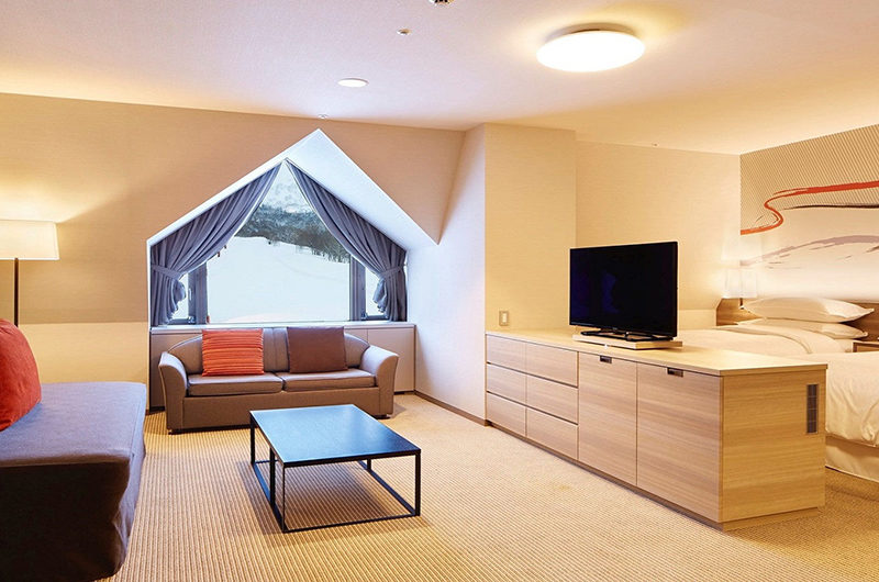 Sheraton Kiroro Hokkaido Resort Bedroom with Sofa and TV | Kiroro