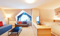 Sheraton Kiroro Hokkaido Resort Bedroom with Seating Area | Kiroro
