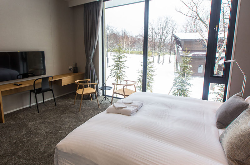 The Kamui Niseko Bedroom with TV and Outdoor View | Annupuri