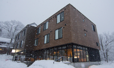 Koharu Resort Hotel and Suites Exterior with Snowfall | Upper Wadano