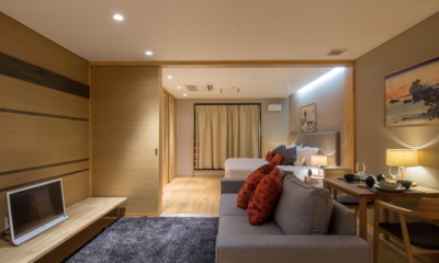 Koharu Resort Hotel and Suites One Bedroom Apartment Bedroom with Sofa and Dining | Upper Wadano