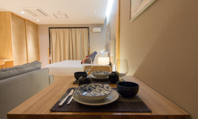 Koharu Resort Hotel and Suites One Bedroom Apartment Bedroom with Dining | Upper Wadano
