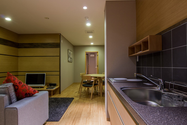 Koharu Resort Hotel and Suites Superior One Bedroom Apartment Living and Dining Area | Upper Wadano