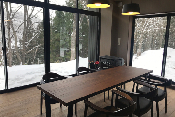 Koharu Resort Hotel and Suites Four Bedroom Villa North Dining Area with Snow View | Upper Wadano