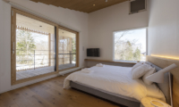 Yukihyo Bedroom with Full Wall Windows | Soga