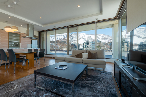 Chatrium Niseko Two Bedroom Penthouse Annupuri Living and Dining Area with TV | Upper Hirafu