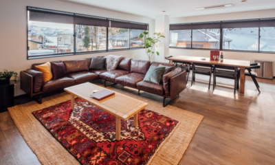 Happo Apartments four bedroom apartment living room with carpet, living room sofa, village views | Happo Village, Hakuba