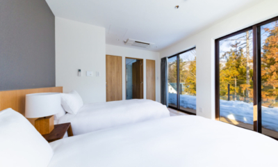 Roka bedroom twin beds with forest view | Happo Village, Hakuba