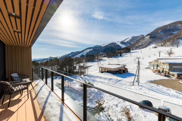 Roka five bedroom penthouse outdoor deck with deck chairs, ski slope view | Happo Village, Hakuba