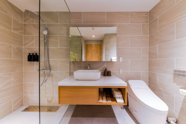 Roka five bedroom penthouse bathroom pink tile shower | Happo Village, Hakuba