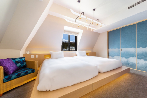 The Happo suite bedroom two beds, seating sofa, window and decorative sliding screen | Happo Village, Hakuba