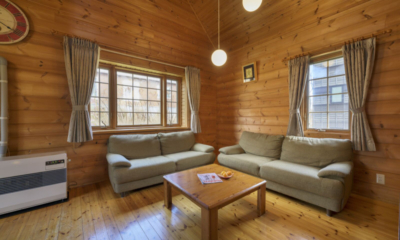 Sapphire Cottage living room with sofas, coffee table | East Hirafu, Niseko